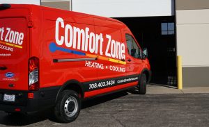Comfort Zone Service van pulling into a garage